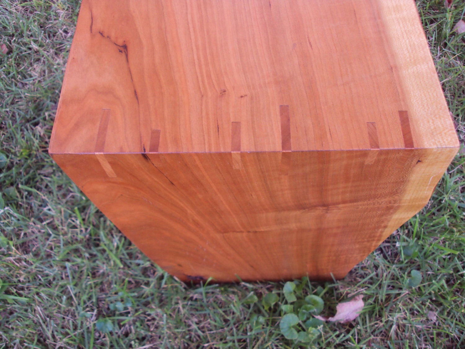 Live-edge cherry bench with natural finish and spline-mitered joinery
