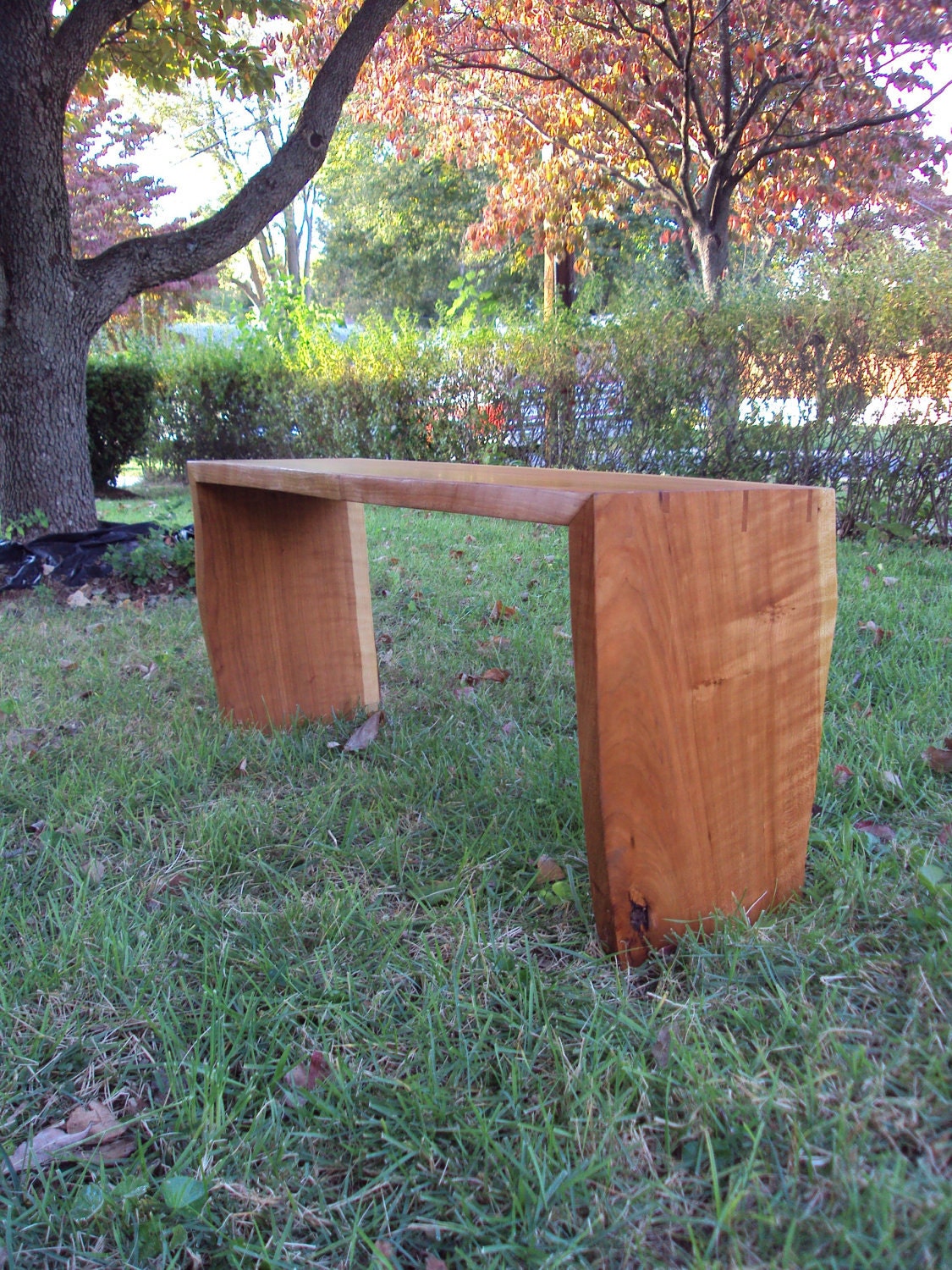 Live-edge cherry bench with natural finish and spline-mitered joinery
